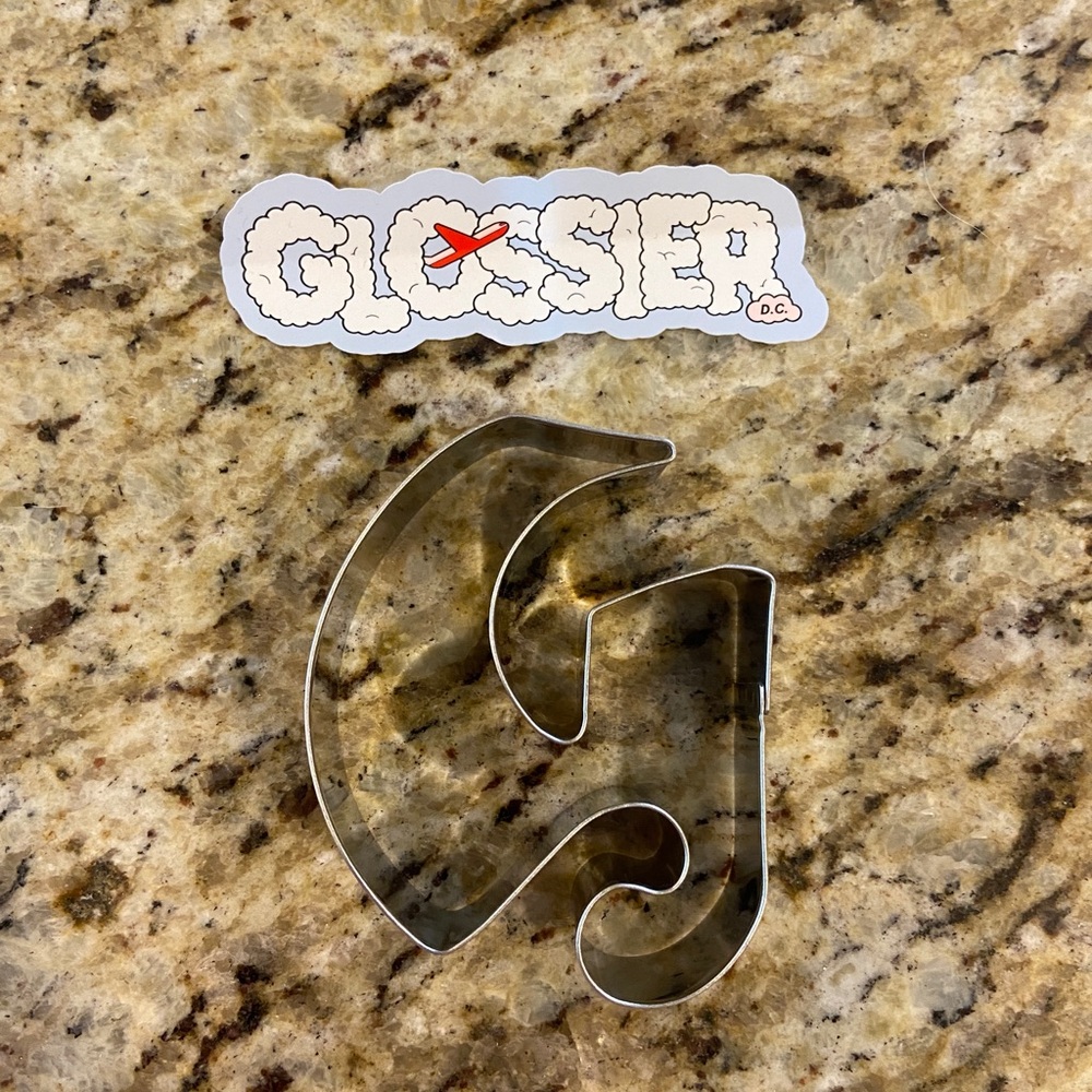 Glossier cookie cutter and Washington DC sticker